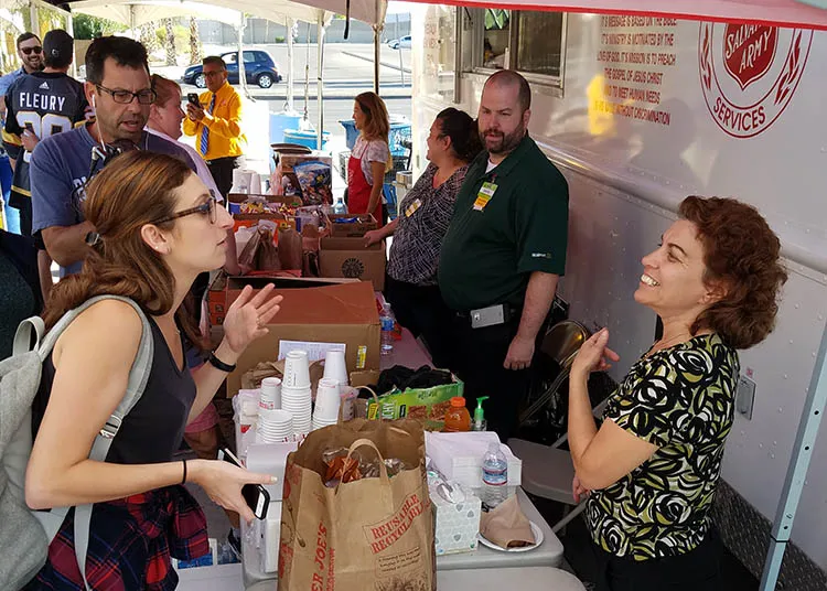 Culinary experts presenting food handler guidelines at local event